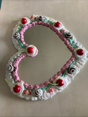 Heart shaped candy cake  mirror with chocolates and cherries